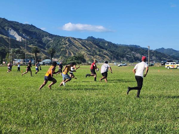 The game of touch rugby that officers organised for the community and got involved in.