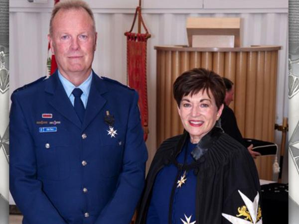 John with then Governor-General Dame Patsy Reddy at his investiture as an Officer of the Order of St John in 2020... 
