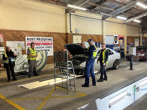 Examining potentially unsafe vehicles.