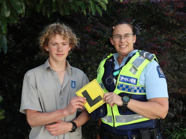 Havelock North High Year 11 student Toby Kilduff with Chris after gaining his learner's licence.