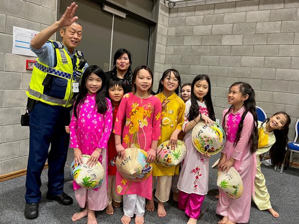 Sergeant John Zhu with children at the celebrations
