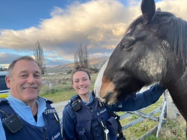 Rural Liaison Officer Paddy Henderson and Constable Sophie McSkimming with one of the horses participating in their 'Grab the Re