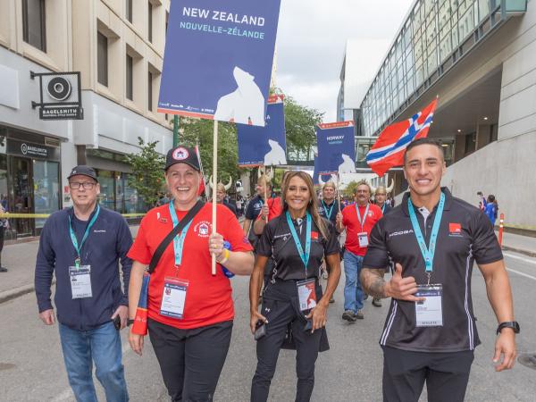 Constable Tyson Ripia (far right) walking in the parade during the opening ceremony of the Games.