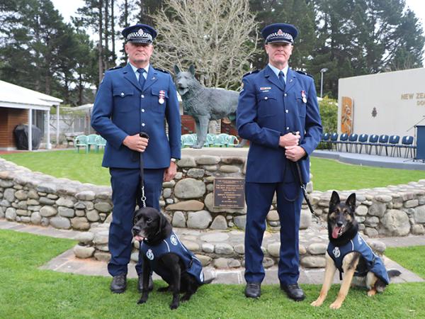 Senior Constables Hamish Todd, with E-Zak, and Reuben Whalley and Wolfe.