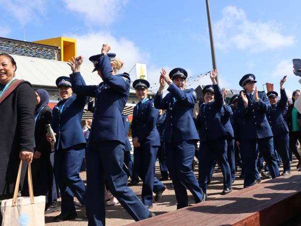 NZ Police officers cheering during the parade.