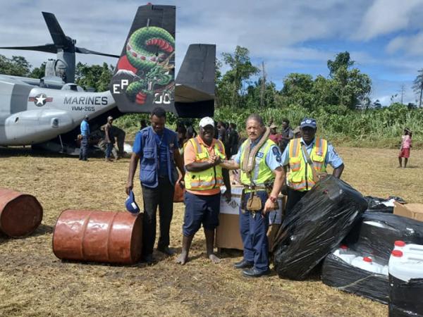 Team Leader Shawn Rutene officially hands over the New Zealand Government's aid supplies.