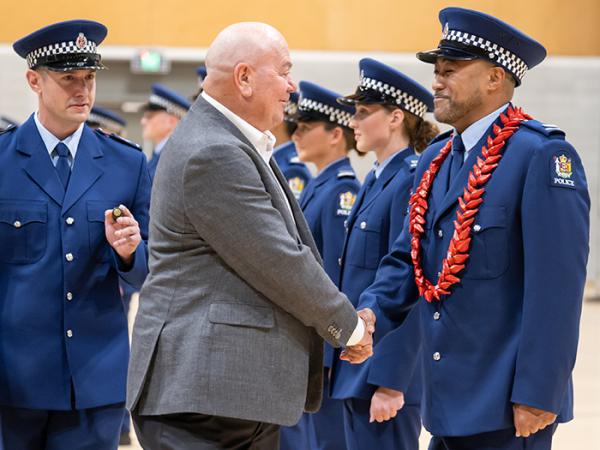 Patron Paddy O'Brien and a wing member share a moment during inspection.