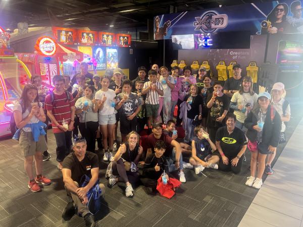 A group shot of everyone smiling and some holding their thumbs up.