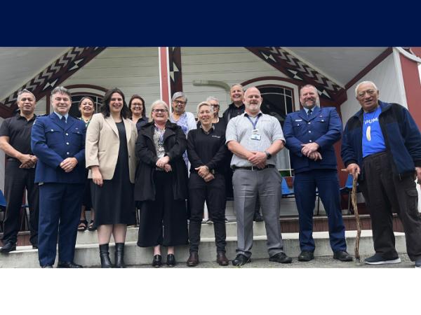 Group shot of Police staff and members of Te Atiawa ki Whakarongotai outside the marae.
