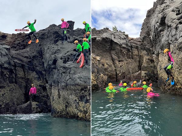Two photos of team members jumping into the sea from rocks, while carrying their rescue gear.