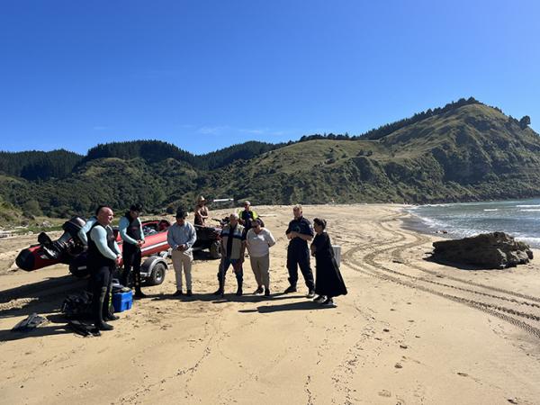 A karakia on Waipatiki Beach before the search for any further bones began. 