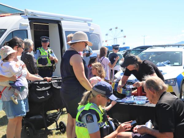 Members of the team chatting to members of the public.