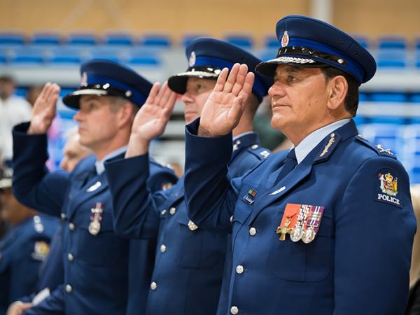 Group shot of Commissioner Andrew Coster, Deputy Commissioner Chris de Wattignar and Deputy Commissioner Wally Haumaha saluting.