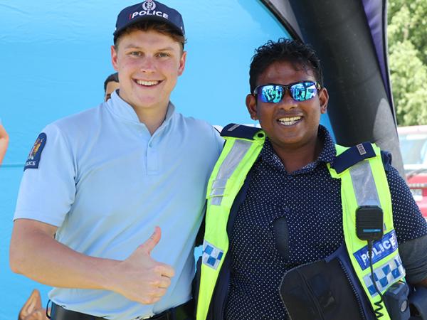 Gore Constable Lucas Dickison helps out with a BAS fitting for a keen visitor.