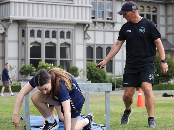 Physical Education Officer Glen Robertson taking the students through a modified PCT.