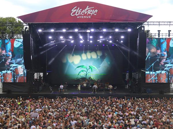 Wide shot of the man stage and crowds at Electric Avenue.