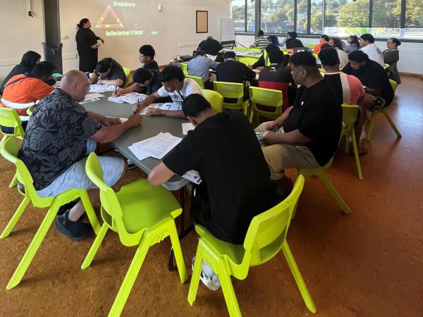Participants working in a classroom setting.