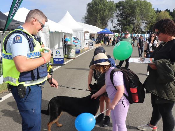 Police pup Iha enjoying pats from attendees.