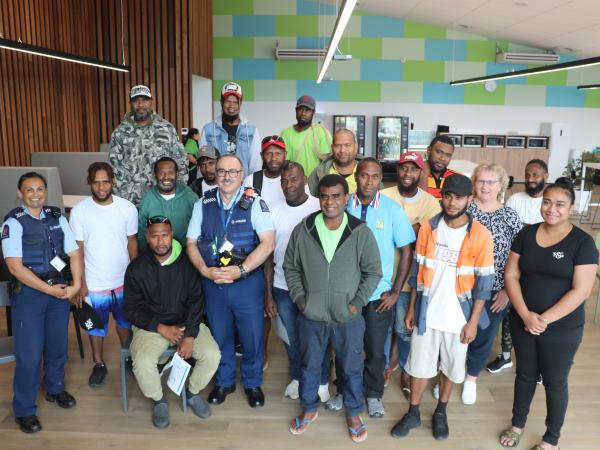Acting Sergeant Eve Tremain and Senior Constable Pehi Potaka speak with RSE workers from Vanuatu with the support of their emplo