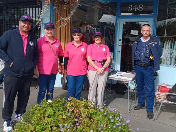 Phil with local Palmerston North Neighbourhood Support volunteers at the Hokowhitu Farmers Market where they had a stall setup f