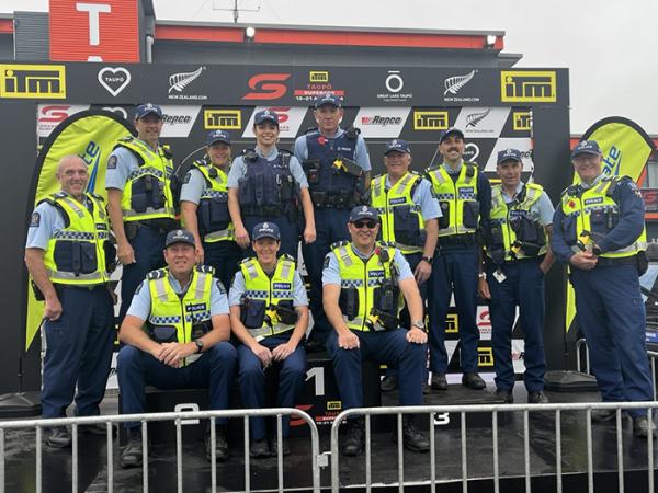 A quick podium photo opportunity for some of the staff.
