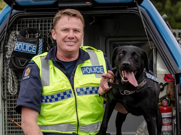 Sergeant Chris Harris and Floyd. During his Police career, Floyd has attended more than 1,000 jobs and located countless firearm