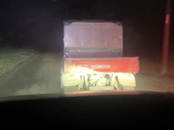 The Kubota ATV heading off into the early morning.