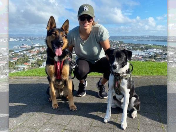 Detective Constable Sam Cates and her dogs Buck and Hunter.