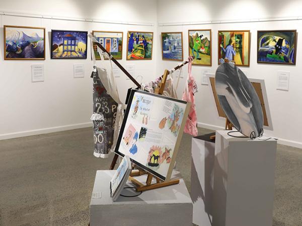 Paintings, sewn artworks and an illustrated story on display as part of the exhibition. 
