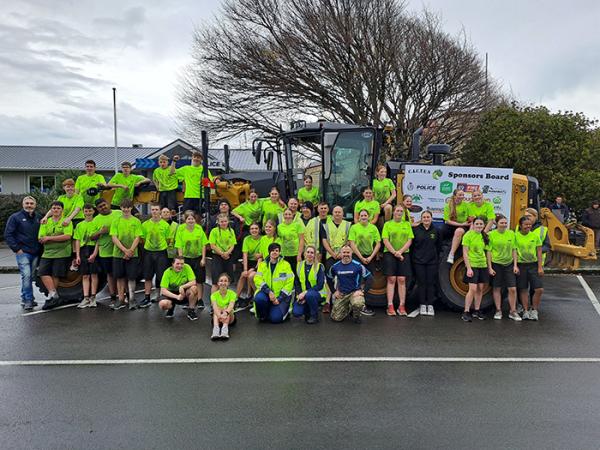 A job well done - Feilding CACTUS students and staff take a well-earned rest outside the local Police station on the Longest Day