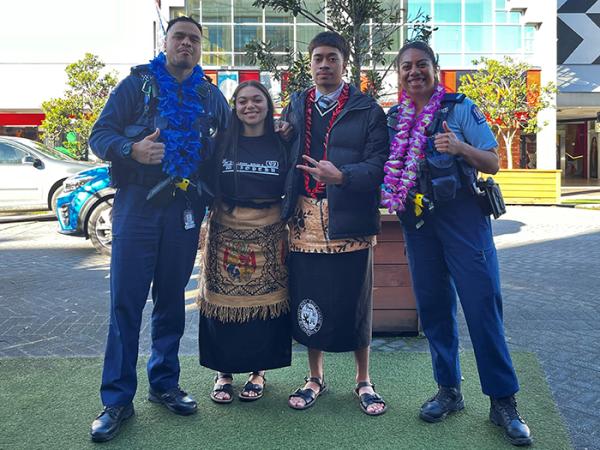 Constables Fala Matua and Penina Maisiri with some festival students outside the theatre.