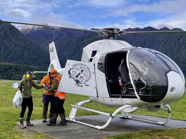 Precision Helicopters loads supplies to take into the field.