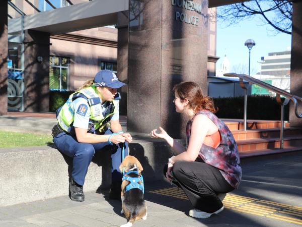 Emily and Murphy talking to a member of the public.