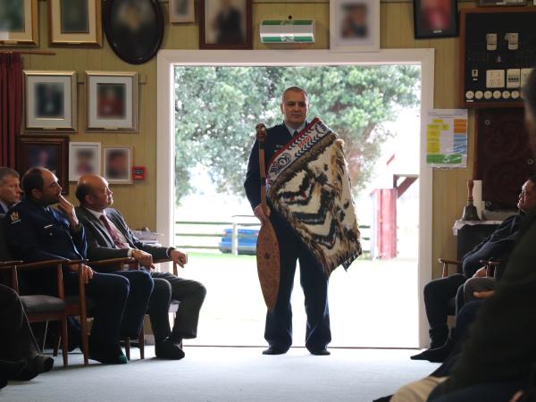 Superintendent Dion Bennett speaks to attendees at his pōwhiri.