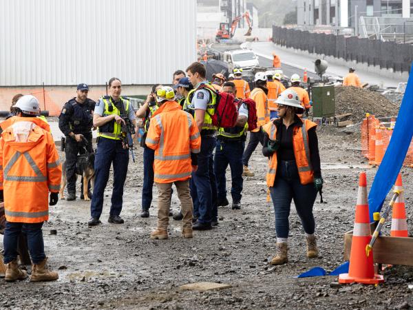 First responders arrive as construction workers are corralled to safety.