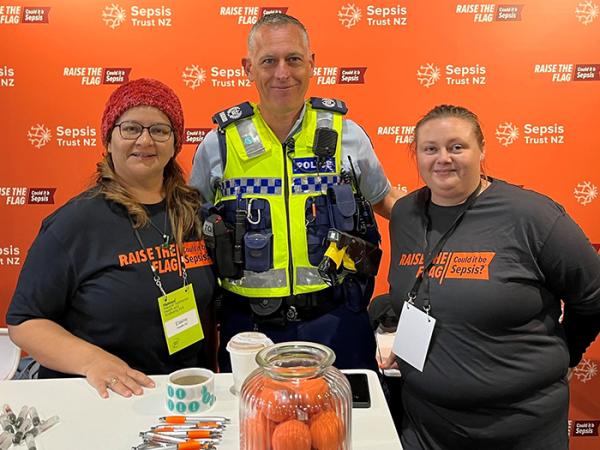 Waikato Hospital staff members - Clinical Care Nurse Elaine Fernandes with Detective Senior Sergeant Ian Foster and with Morgan 