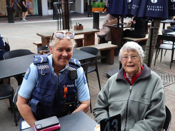 Senior Constable Dominie Cresswell talking with a resident in Napier CBD.