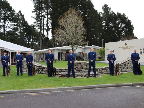 A line up of the graduating handlers with their course trainers and Inspector Todd Southall.