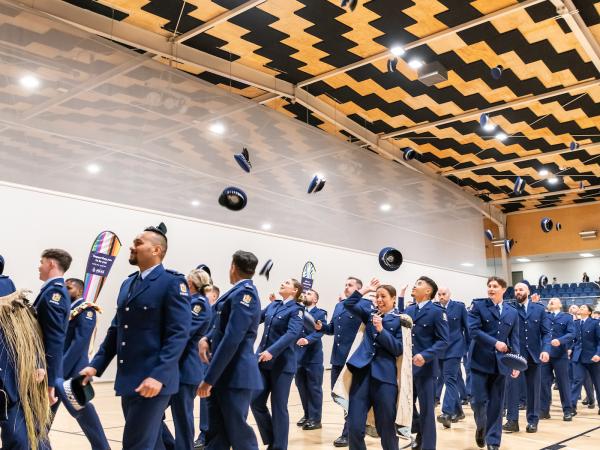 Wing 378 throwing their hats in the air after the parade's dismissed.