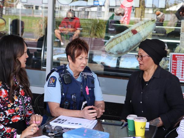 Constable Hazel Mitchell chats with Napier City Councillor Sally Crown (left) and a local.