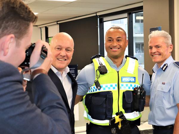 Constable Cezanne Lea’atoa flanked by Commissioner Richard Chambers and the Prime Minister.