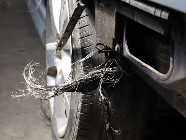 A bald and badly damaged tyre.