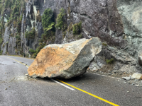 Picture of big rock in middle of road