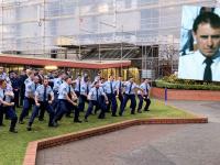 Recruits from Wing 328 pay tribute to Sergeant Derek Wootton (inset) at the Memorial Wall.