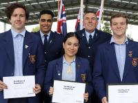 Three proud Police Pathways students alongside Sergeant Roger Newton and Inspector Scott Miller.