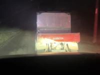 The Kubota ATV heading off into the early morning.