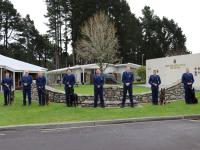A line up of the graduating handlers with their course trainers and Inspector Todd Southall.