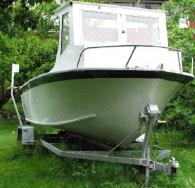 Plywood launch.  White hull, deck.  Dist